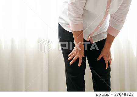 senior woman suffering from knee pain at home, health problem concept senior woman suffering from knee pain at home, health problem concept 57049225
