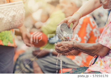 Thai people celebrate Songkran by pouring water and giving garlands to elder senior or respected grandparents and elder and asked for blessings for celebrate Songkran in new year water festival 57050170