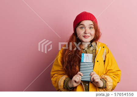 positive beautiful tourist going to travel around the world positive beautiful tourist going to travel around the world 57054550