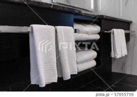 Close up of luxury bathroom towels in a monochrome ensuite Close up of luxury bathroom towels in a monochrome ensuite 57055750
