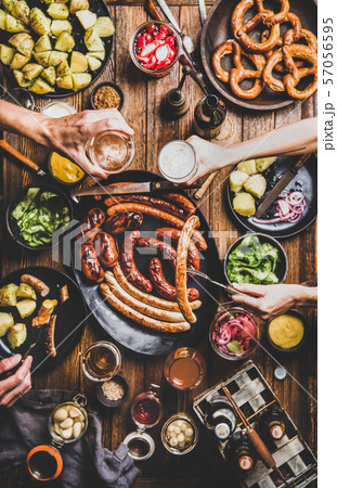 Octoberfest dinner table with beer, sausages and 57056595