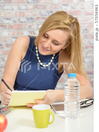 beautiful blonde business woman working at office beautiful blonde business woman working at office 57056963