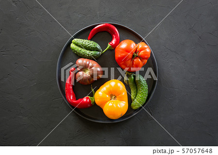 Ugly organic colorful tomato, pepper, cucumber 57057648