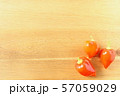 fresh orange ghost chili peppers on a wooden board 57059029