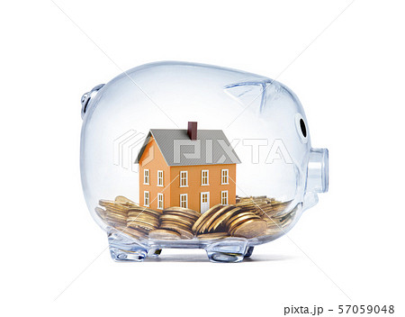 Orange house on money inside transparent piggy bank with clipping path  57059048