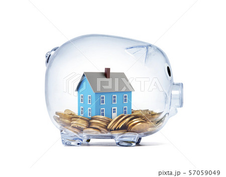 Blue house on money inside transparent piggy bank with clipping path Blue house on money inside transparent piggy bank with clipping path 57059049