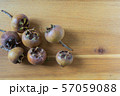 fresh medlar fruits on a wooden board 57059088
