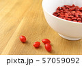 dried goji berries in a small white bowl 57059092