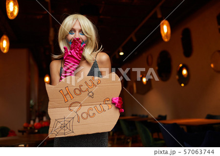 Woman Wearing Costume at Halloween Party Woman Wearing Costume at Halloween Party 57063744