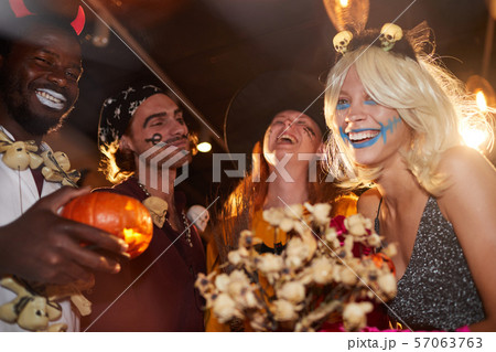 Having Fun at Halloween Party in Nightclub 57063763
