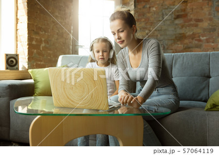 Teacher and little girl, or mom and daughter. Homeschooling concept 57064119