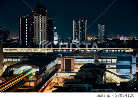 Night view of BTS sky train running in Bangkok 57064120