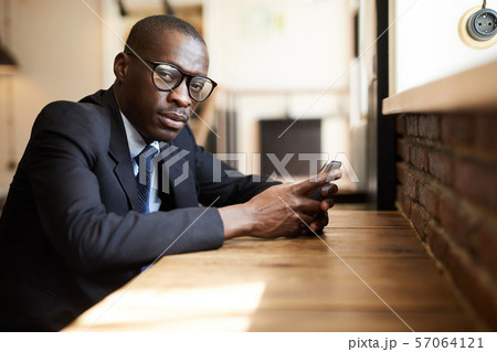 African-American Businessman in cafe African-American Businessman in cafe 57064121