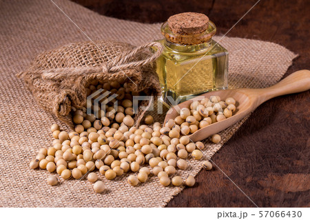 Soybean oil on a wooden background. rustic style Soybean oil on a wooden background. rustic style 57066430
