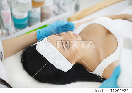 Skin Care. Phonophoresis procedure for a beautiful woman. 57069926