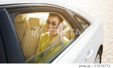 Go on taxi. Woman talking on phone in car Go on taxi. Woman talking on phone in car 57070773