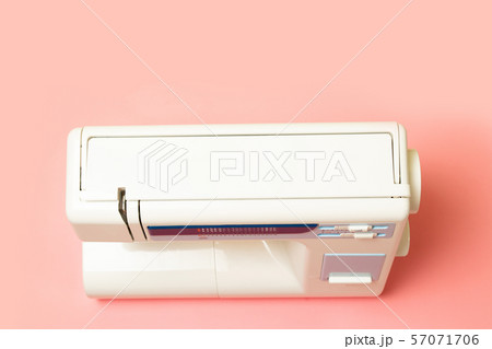 Sewing machine on pink table. View from above 57071706
