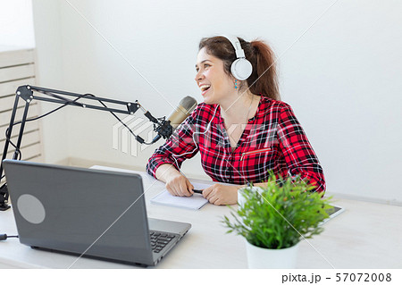 Radio host, blogging, broadcasting concept - young woman working on the radio 57072008