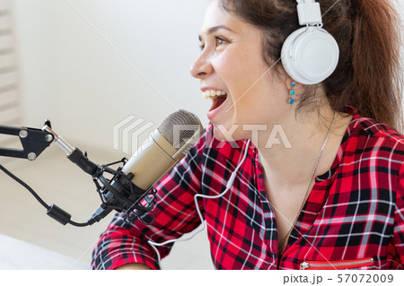Radio, blogging, podcasting concept - close-up woman presenter on the radio 57072009