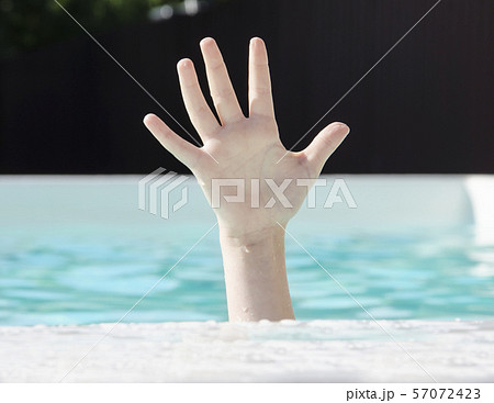hand of a drowning child in the pool, need help  57072423