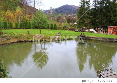 Private trout farm with lake among mountains 57073331