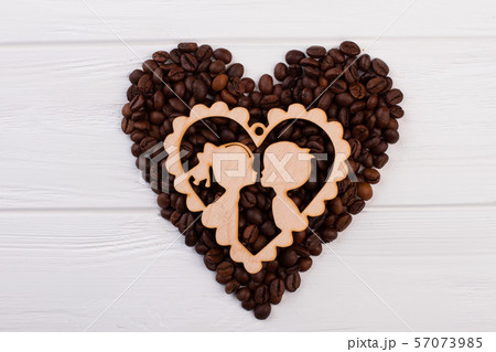 Heart shaped coffee beans for Valentines Day. 57073985