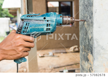 Drill machine drilling a cement Drill machine drilling a cement 57082678