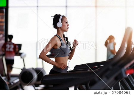 Fitness woman wearing headphone cardio workout at 57084062