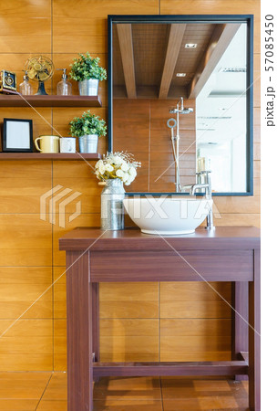 Interior of bathroom with sink basin faucet and mirror Interior of bathroom with sink basin faucet and mirror 57085450