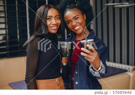 two pretty girls in a cafe two pretty girls in a cafe 57085648