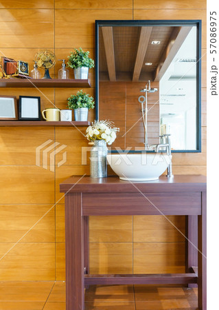 Interior of bathroom with sink basin faucet and mirror 57086975