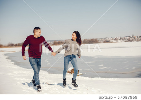 Couple in a winter park 57087969