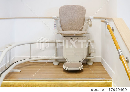 Automatic stair lift on staircase for elderly people Automatic stair lift on staircase for elderly people 57090460