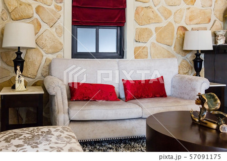 modern living room with red pillows on cozy sofa and lamp modern living room with red pillows on cozy sofa and lamp 57091175
