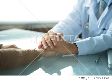Doctor reassures the girl patient in medical office Doctor reassures the girl patient in medical office 57091358