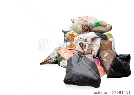 Teddy bear on the garbage pile isolated in white background. 57091411