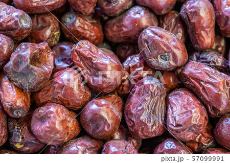 counter in a store with dried dates close-up. 57099991