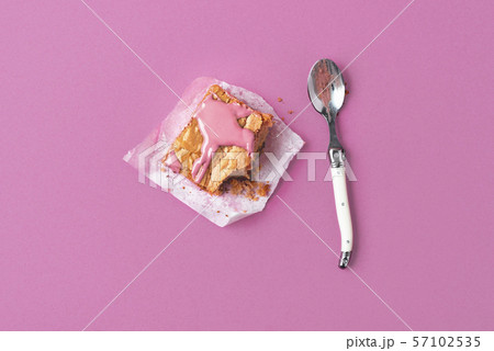 Eating a brownie cake with pink chocolate 57102535