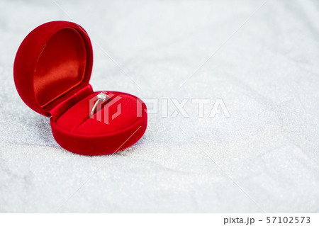 Red ring box with diamond ring for wedding day 57102573