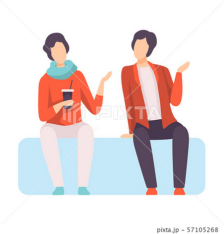 Two Young Men Dressed in Stylish Clothing Sitting on Sofa and Talking, People Speaking to Each Other 57105268