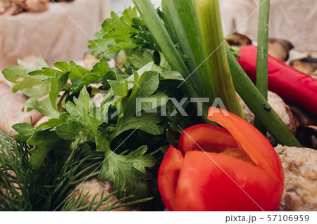 Close-up of fresh greenery and tomato.Close-up of 57106959