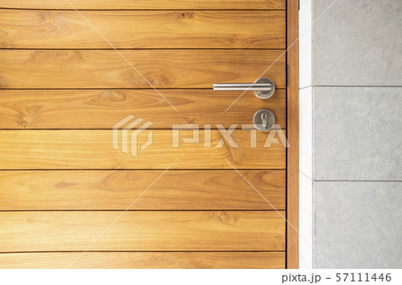 Stainless steel door handle and wooden door 57111446