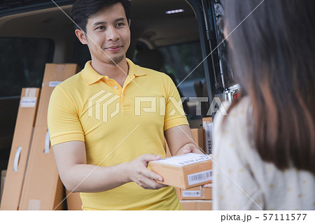 Young Asian Delivery man delivering packages Young Asian Delivery man delivering packages 57111577
