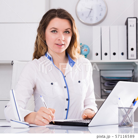 Portrait of young female in the office Portrait of young female in the office 57116589