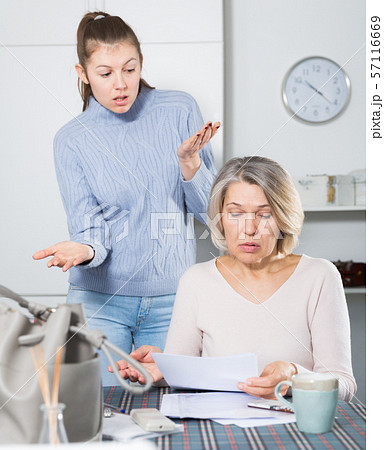 Unhappy woman with documents, family quarrel Unhappy woman with documents, family quarrel 57116669