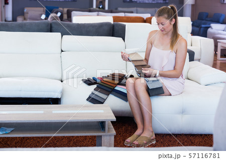 female choosing quality textile on sofa 57116781