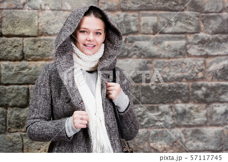 teenager girl in hood near wall 57117745