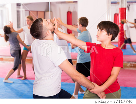 Kids exercising self-defense movements Kids exercising self-defense movements 57117746