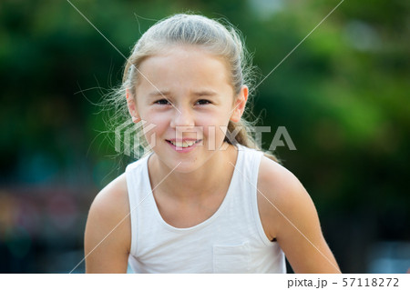 Portrait of happy girl outdoors 57118272