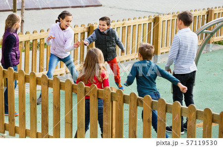 Group of children playing romp game Touch-last outdoors 57119530